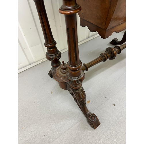 56 - A Victorian Burr Walnut Games Table. The table top opens to reveal Chess, back gammon and cribbage b... 