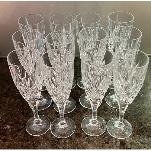 570 - Twelve cut glass fluted glasses