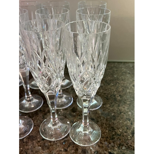 570 - Twelve cut glass fluted glasses