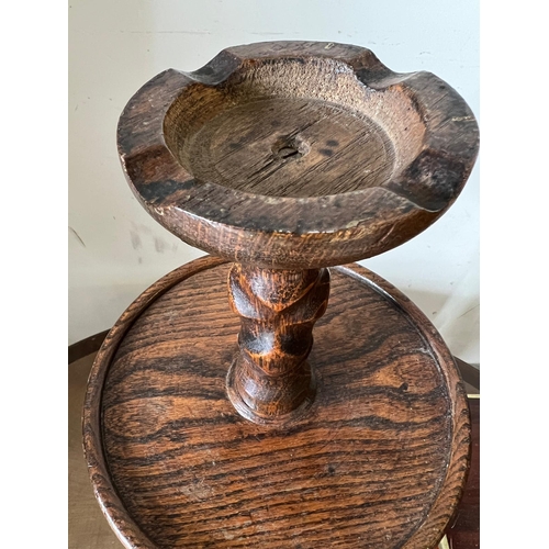 60 - An oak turned floor standing ashtray,(H70cm Dia27cm)