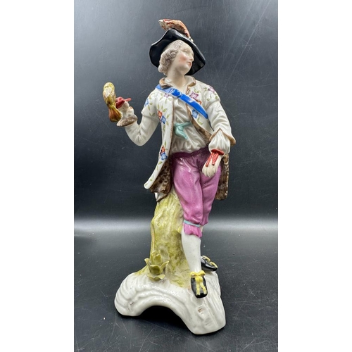 615 - Two hand painted figurines in the manner of Dresden. A gentleman with a hawk and a lady with a baske... 