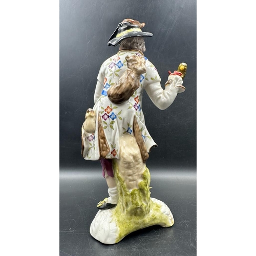 615 - Two hand painted figurines in the manner of Dresden. A gentleman with a hawk and a lady with a baske... 