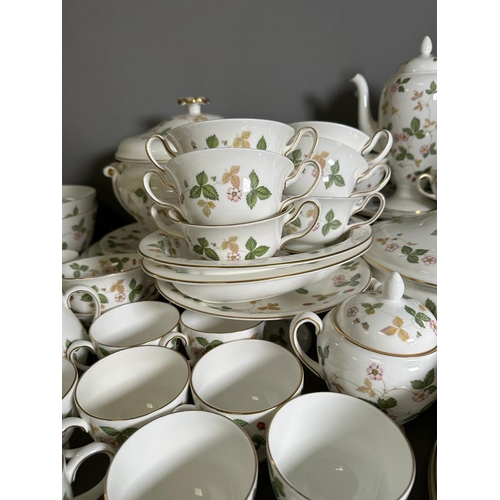 630 - A substantial dinner and tea service by Wedgewood in the wild strawberry pattern