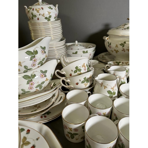 630 - A substantial dinner and tea service by Wedgewood in the wild strawberry pattern