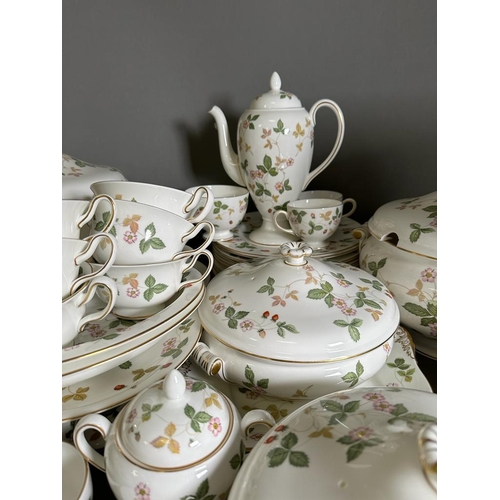 630 - A substantial dinner and tea service by Wedgewood in the wild strawberry pattern