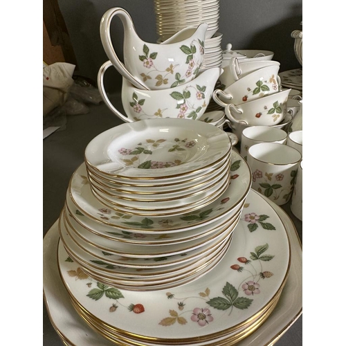 630 - A substantial dinner and tea service by Wedgewood in the wild strawberry pattern