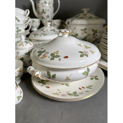 630 - A substantial dinner and tea service by Wedgewood in the wild strawberry pattern