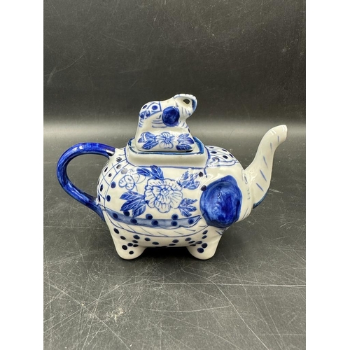 639 - A selection of four Chinese blue and white tea pots to include a doughnut shaped and a miniature ele... 