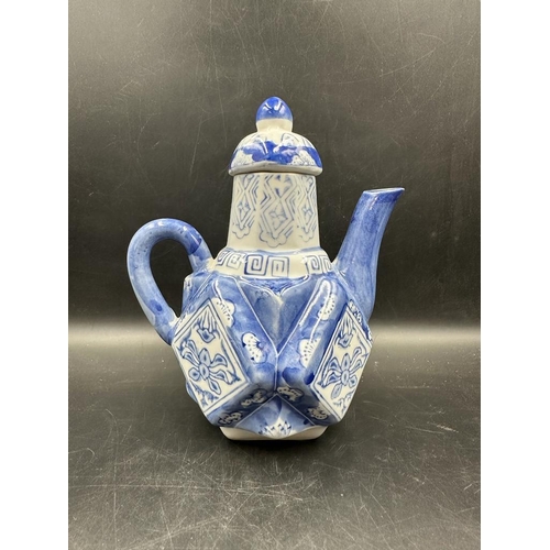 639 - A selection of four Chinese blue and white tea pots to include a doughnut shaped and a miniature ele... 