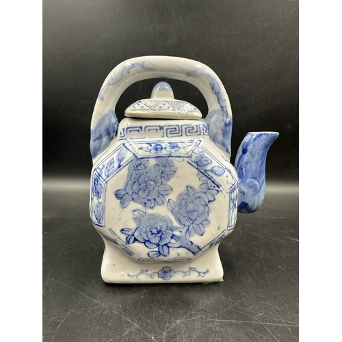 639 - A selection of four Chinese blue and white tea pots to include a doughnut shaped and a miniature ele... 