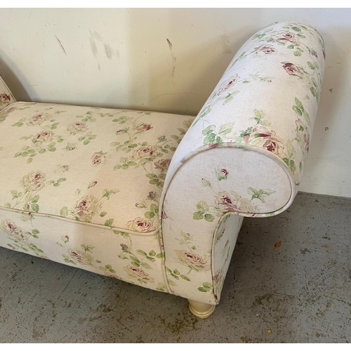 64 - A fabric covered, rose pattern, window seat on turned cream legs (H 66cm x 47cm D 130cm W)