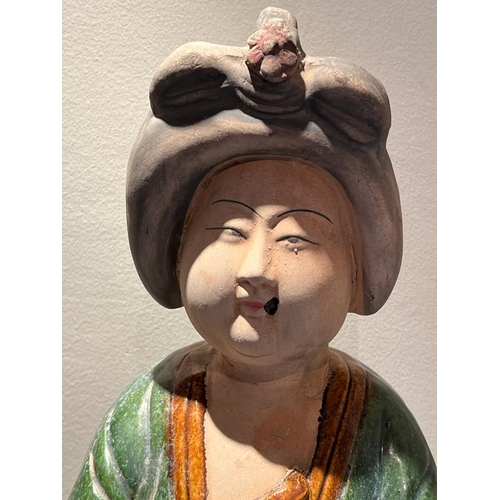 644 - Two Chinese clay figurines in traditional dresses