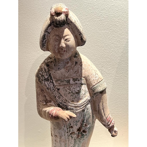 644 - Two Chinese clay figurines in traditional dresses