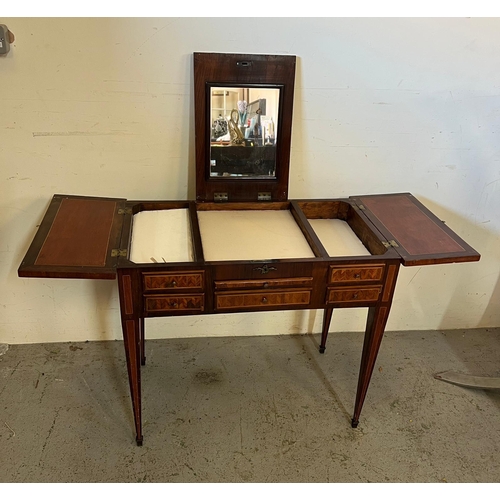 65 - A Louis style geometric marquetry dressing table rectangular top opening to fitted interior and mirr... 