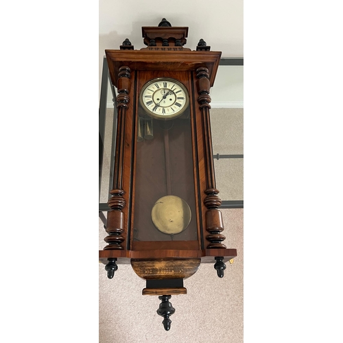 652 - An eight day regulator wall clock by Gustav Becker in a walnut case c1880 . Weights, pendulum  and k... 