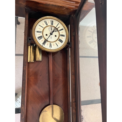 652 - An eight day regulator wall clock by Gustav Becker in a walnut case c1880 . Weights, pendulum  and k... 