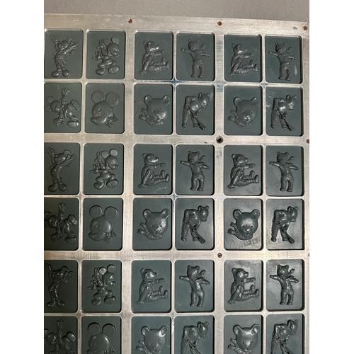 667 - A steel moulding  plate featuring Disney characters and Mr Men