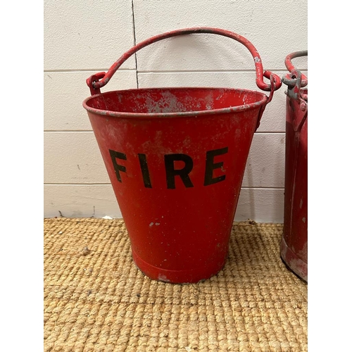 673 - Two vintage red fire buckets