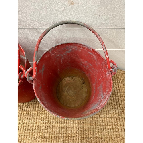 673 - Two vintage red fire buckets