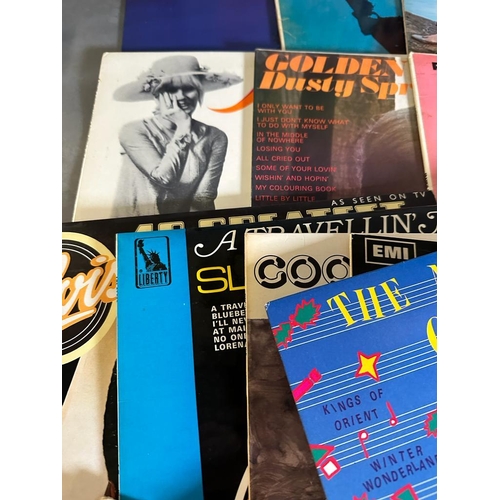 692 - a selection of vinyl Lp's and singles to include The Rolling Stones, Johnny Cash and Ray Charles