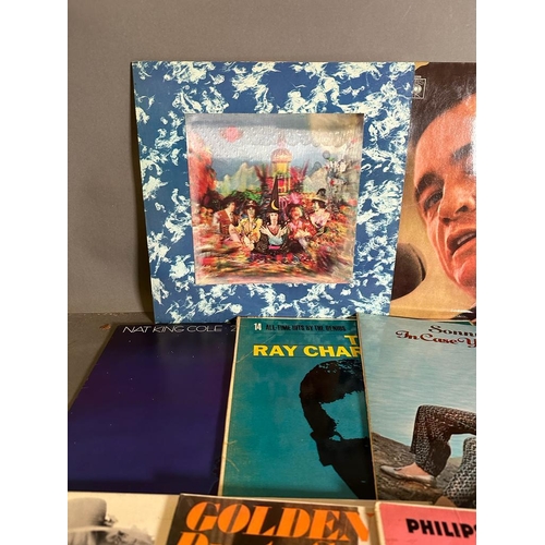 692 - a selection of vinyl Lp's and singles to include The Rolling Stones, Johnny Cash and Ray Charles