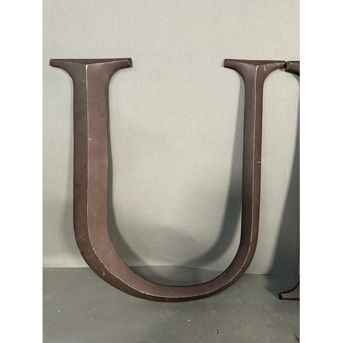 694 - Two metal wall hanging letters, U and K