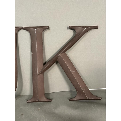 694 - Two metal wall hanging letters, U and K