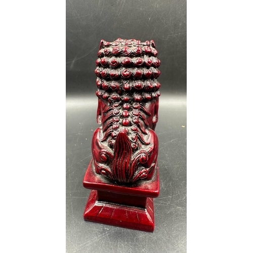 695 - A pair of red resin Chinese foo dogs