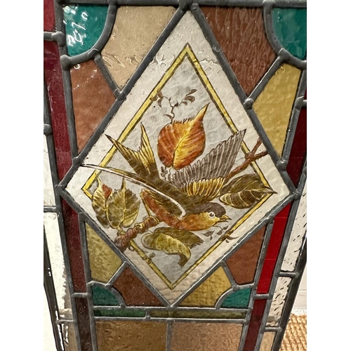 699 - A selection of three leaded stained glass panels, one featuring the number 16. 103x30