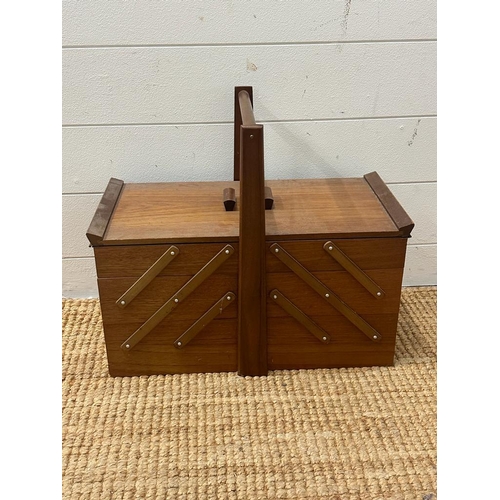 700 - A Mid Century multi tiered sewing box haberdashery included