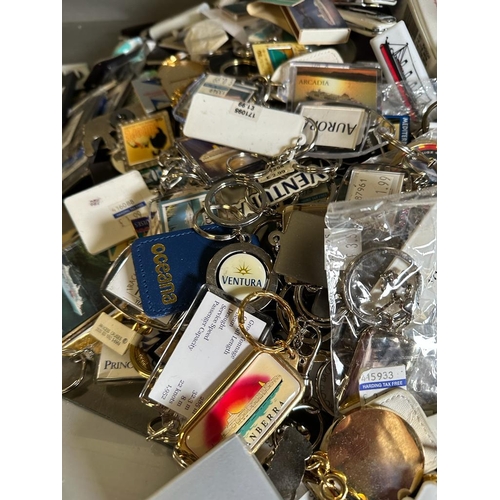 703 - A large quantity of cruise liner collectables and ephemera to include key chains, bottle openers and... 