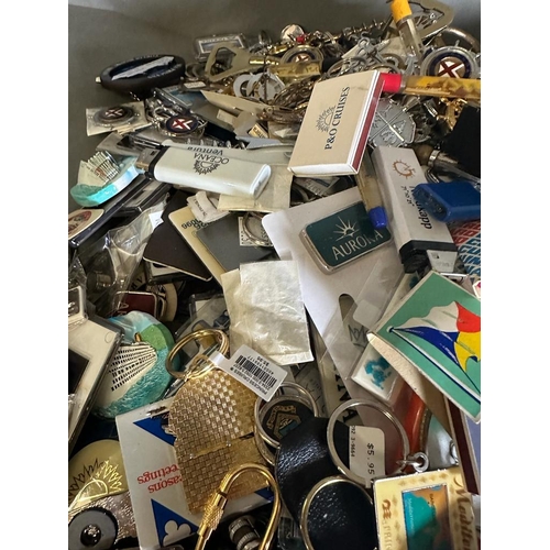 703 - A large quantity of cruise liner collectables and ephemera to include key chains, bottle openers and... 