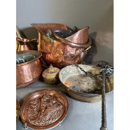 706 - A selection of copper, brass and white metal items to include jugs, trays and a coal scuttle