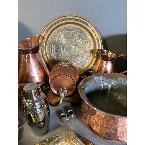 706 - A selection of copper, brass and white metal items to include jugs, trays and a coal scuttle