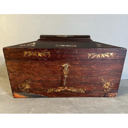 708 - A mahogany tea caddy with mother of pearl inlay and turned handles