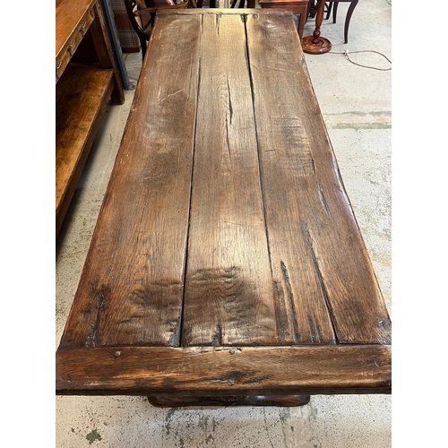 71 - An Elizabethan jointed oak refectory table with three plank top on baluster legs and stretchers (82c... 