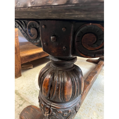 71 - An Elizabethan jointed oak refectory table with three plank top on baluster legs and stretchers (82c... 