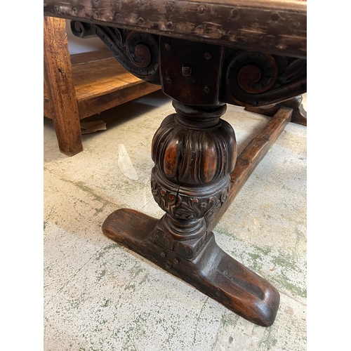 71 - An Elizabethan jointed oak refectory table with three plank top on baluster legs and stretchers (82c... 