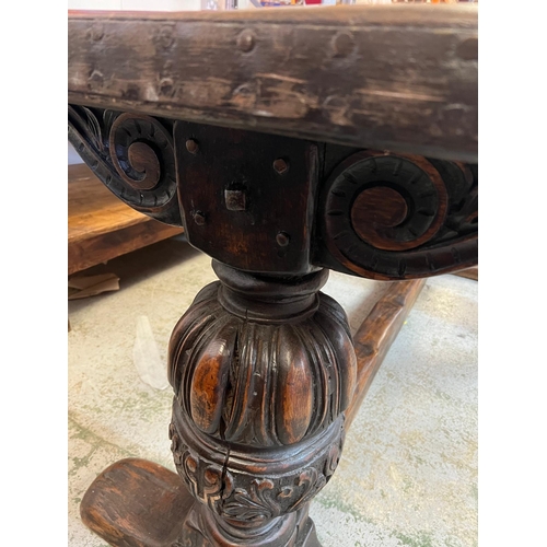 71 - An Elizabethan jointed oak refectory table with three plank top on baluster legs and stretchers (82c... 