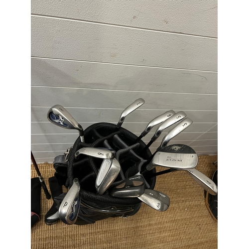 751 - A set of golf clubs with accessories, various cubs and markers including Odyssey, Callaway Big Berth... 