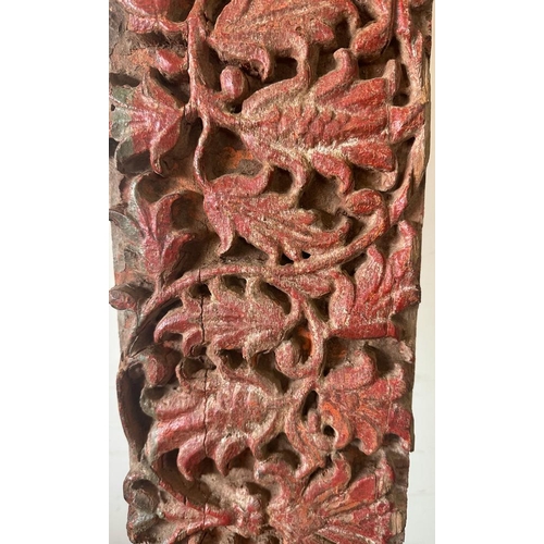 93 - A Burmese hand carved wall hanging oak panel with red painted floral relief 234cm x 18cm