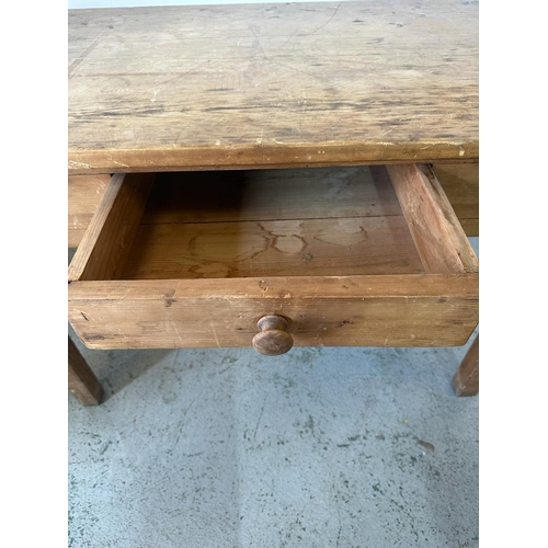 94 - A pine kitchen table with single drawer to centre (H78cm D66cm W119cm)