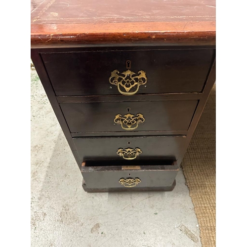 96 - A mahogany pedestal desk with brown leather top and comprising of 3 drawers to right and four to lef... 