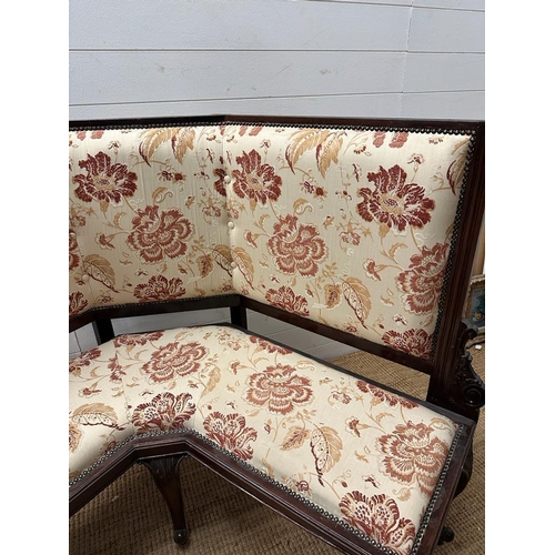 97 - A Victorian mahogany framed corner bench upholstered in a white ground and floral pattern (H107cm W1... 