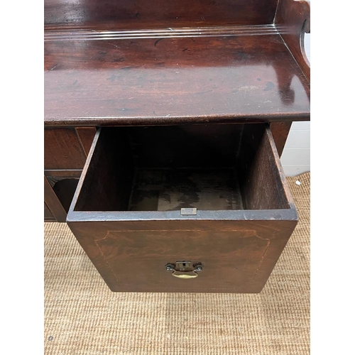 209 - A mahogany sideboard or serving table with cellarette drawer (H103cm W135cm D59cm)