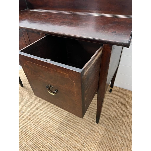 209 - A mahogany sideboard or serving table with cellarette drawer (H103cm W135cm D59cm)