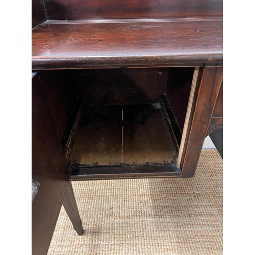 209 - A mahogany sideboard or serving table with cellarette drawer (H103cm W135cm D59cm)