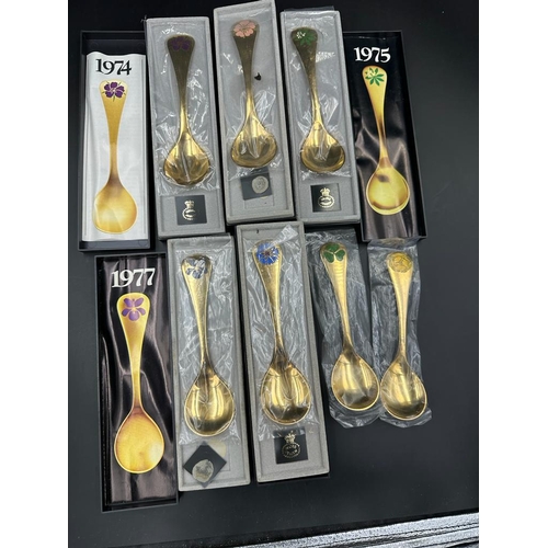 459A - Georg Jensen, seven modern Danish silver-gilt and enamel year spoons,1972, 1974-79 the terminals ena... 