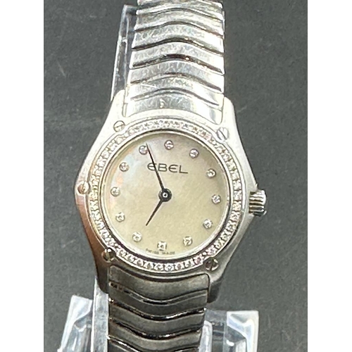 486A - A Ladies Ebel Diamond bezel watched, boxed with papers.