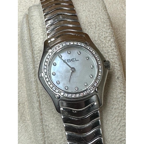 486A - A Ladies Ebel Diamond bezel watched, boxed with papers.